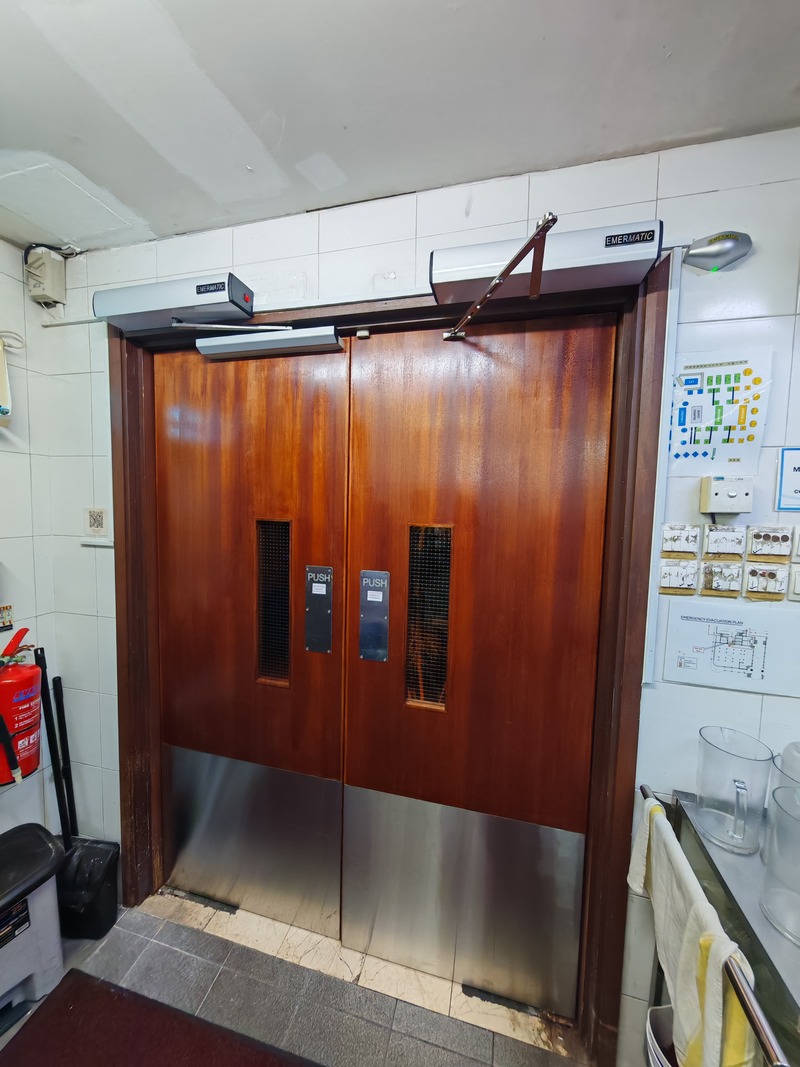 Singapore Swimming Club Auto Swing Kitchen Doors